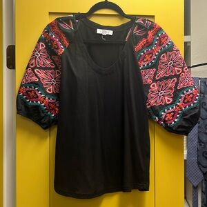 Puffy sleeve top with colorful embroidery.